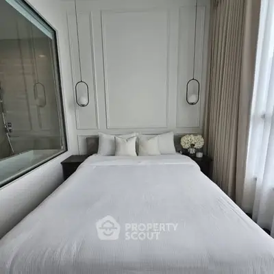 Elegant bedroom with modern design and large window for natural light