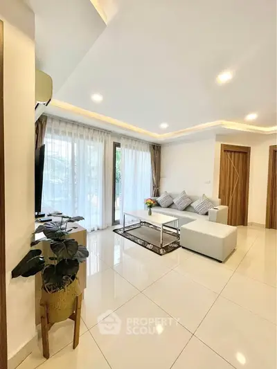 Spacious modern living room with elegant decor and natural light