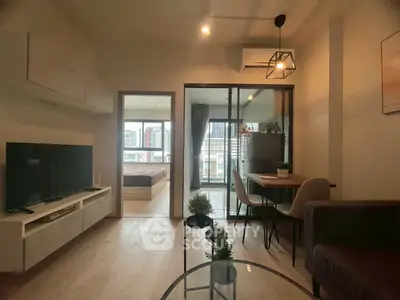 Modern living room with balcony view and stylish decor in urban apartment
