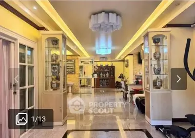 Luxurious living room with elegant lighting and decorative display cabinets