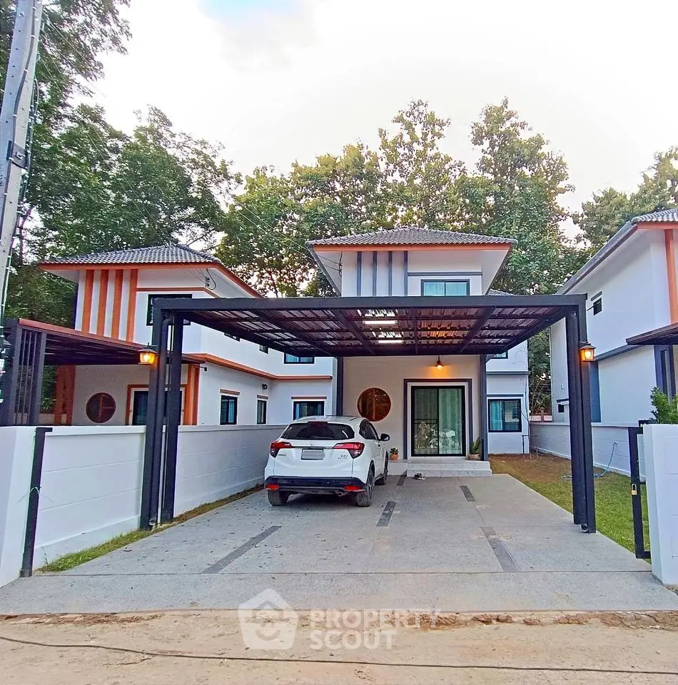 Modern two-story house with carport and driveway in suburban setting