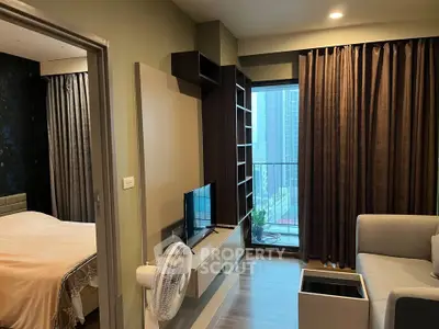 Modern apartment interior with cozy living room and bedroom, featuring large windows and stylish furnishings.