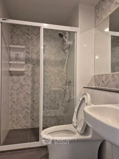 Modern bathroom with glass shower and sleek fixtures