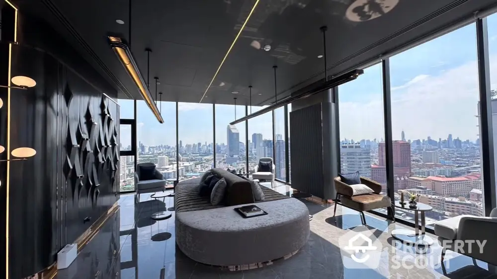 Luxurious modern living room with panoramic city skyline views and elegant furnishings.