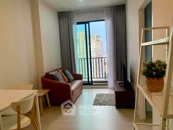 Modern living room with city view, cozy seating, and stylish decor in a high-rise apartment.