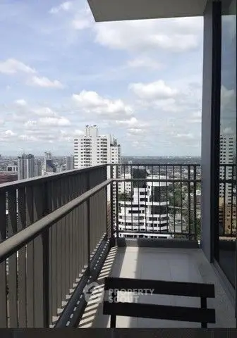 Stunning cityscape view from a modern high-rise balcony, perfect for urban living.
