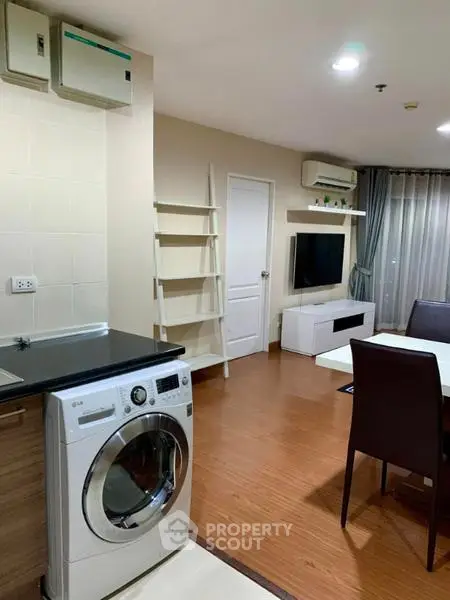 Modern living room with washing machine and stylish decor