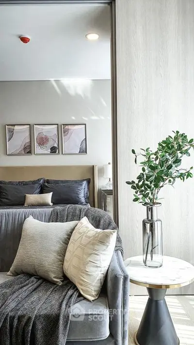 Luxurious modern bedroom with stylish decor and cozy seating area