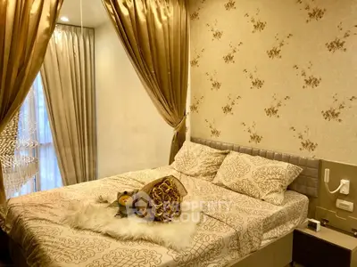 Luxurious bedroom with elegant drapes and plush bedding in a sophisticated apartment.