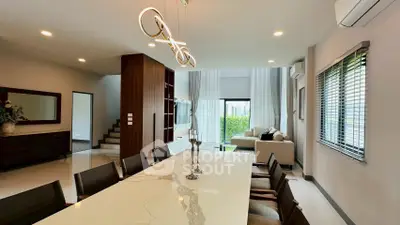 Luxurious modern living room with elegant dining area and stylish lighting