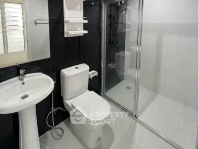 Modern bathroom with sleek design and glass shower enclosure