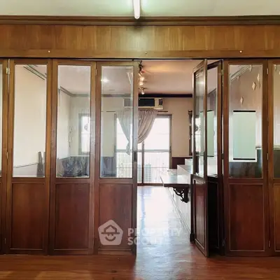 Spacious interior with wooden sliding doors and natural light