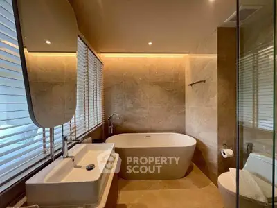 Luxurious bathroom with elegant freestanding bathtub and modern fixtures, perfect for relaxation.