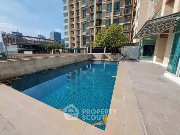 Luxurious apartment building with rooftop pool and city view