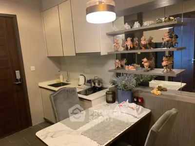 Charming kitchen with elegant dining setup and decorative shelves in modern apartment.