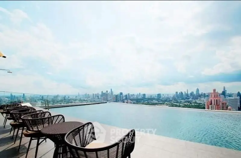 Stunning rooftop infinity pool with breathtaking city skyline view