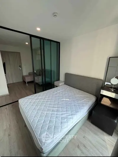 Modern bedroom with glass partition and stylish decor