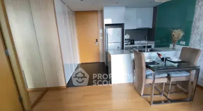 Modern open-layout kitchen with dining area in a stylish apartment