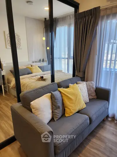 Modern bedroom with cozy sofa and stylish decor in a chic apartment