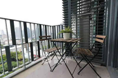 Chic urban balcony with city view, perfect for relaxing and enjoying the skyline.