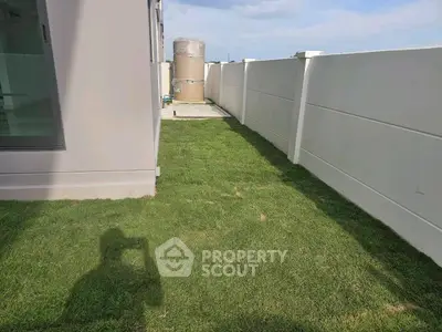 Modern property with spacious backyard and privacy fence, ideal for outdoor activities.