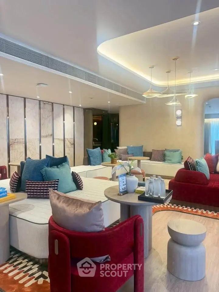 Luxurious modern living room with stylish furniture and ambient lighting, perfect for relaxation and entertainment.