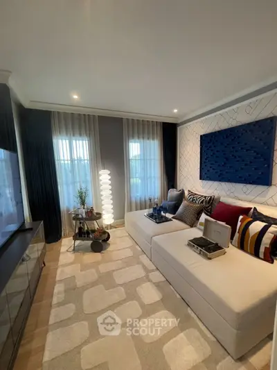 Stylish modern living room with elegant decor and cozy seating area.