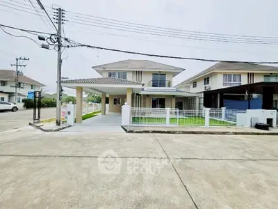 Spacious two-story house with modern design in a serene neighborhood, featuring a well-maintained front yard and driveway.
