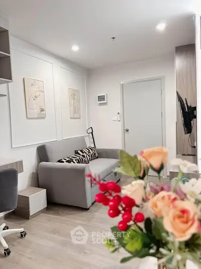 Modern living room with stylish decor and comfortable seating in a cozy apartment.