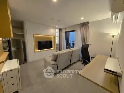 Modern living room with sleek design, featuring a cozy sofa, wall-mounted TV, and balcony access.