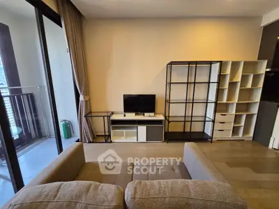 Modern living room with balcony access and stylish shelving units