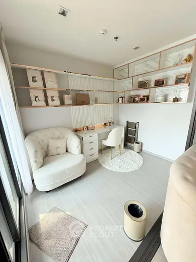 Elegant study room with plush seating and modern decor