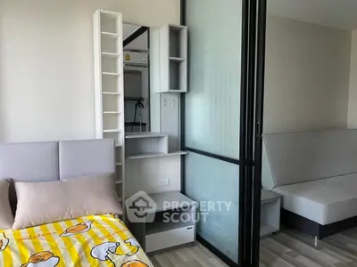 Modern bedroom with sliding glass door and stylish furniture