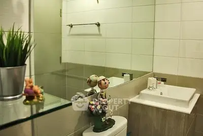 Charming bathroom with modern sink and decorative accents