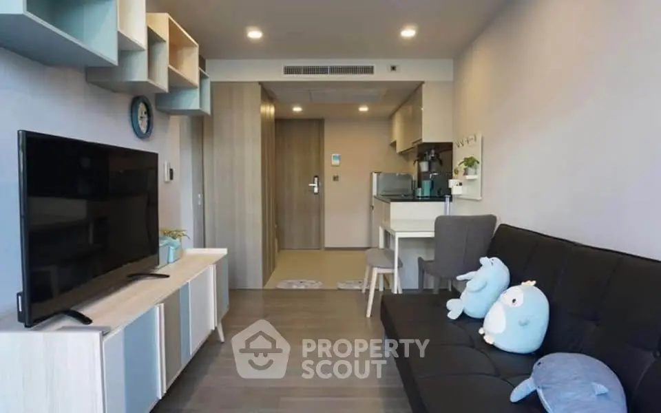 Modern living room with sleek furniture and stylish decor in a cozy apartment.