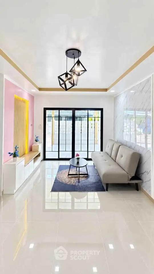 Modern living room with stylish decor and large windows for natural light.