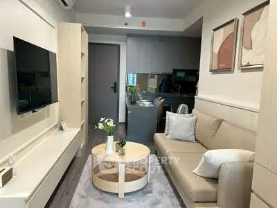 Modern living room with sleek furniture and open kitchen layout