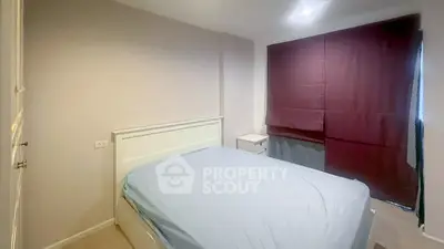Cozy bedroom with modern design and ample natural light
