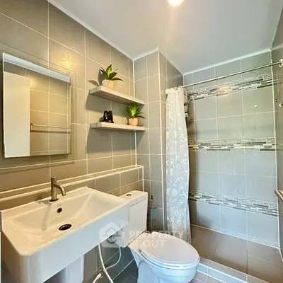 Modern bathroom with sleek fixtures and stylish tile design
