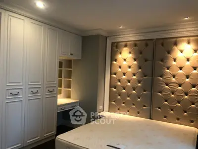 Luxurious bedroom with elegant tufted wall and built-in wardrobe
