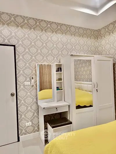 Elegant bedroom with stylish wallpaper and modern furniture