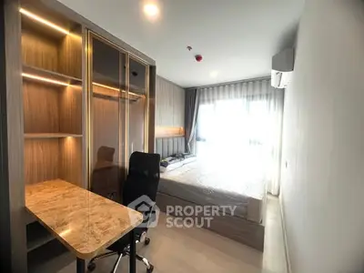 Modern bedroom with study desk and large window, perfect for comfort and productivity.