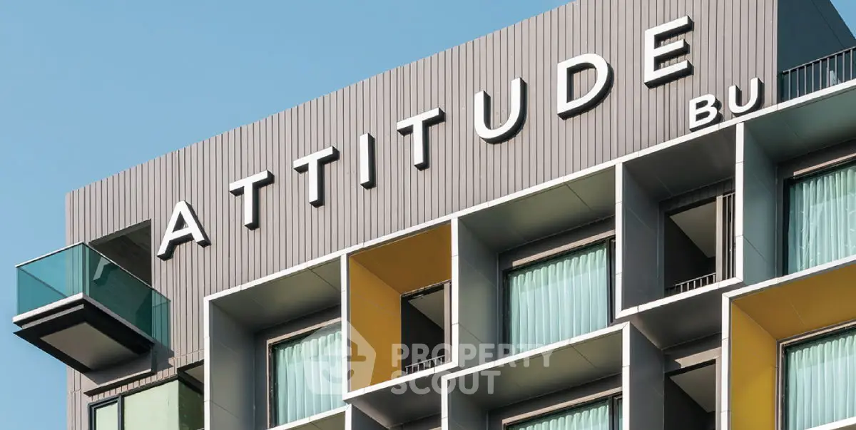 Modern building facade with unique architectural design and balconies.