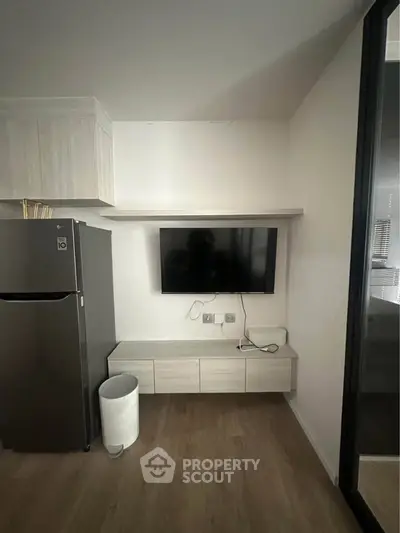 Modern living room with sleek TV setup and stylish storage cabinet