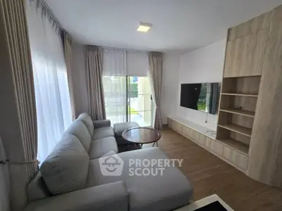 Modern living room with large windows and stylish furniture