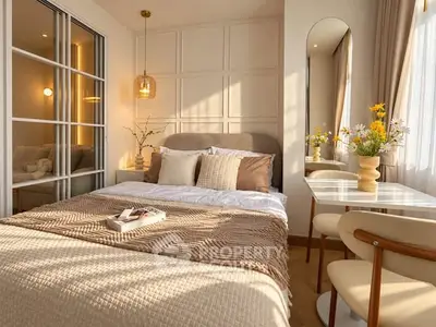 Cozy bedroom with elegant decor, featuring a comfortable bed, stylish lighting, and a charming dining nook.