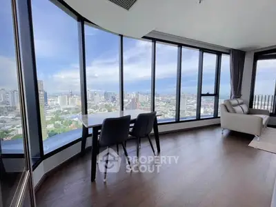 Stunning high-rise apartment with panoramic city views and elegant interior design.