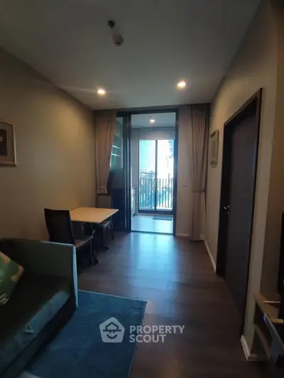 Modern living room with balcony access and stylish decor