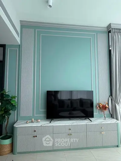 Elegant living room with modern TV setup and stylish decor