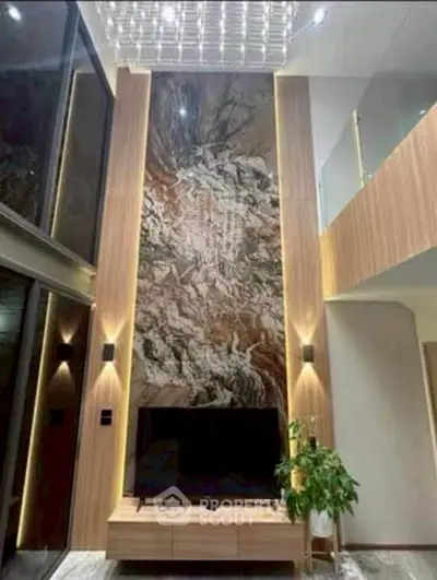 Luxurious modern living room with high ceiling and elegant wall design